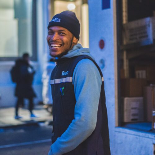 Delivery driver smiling while working