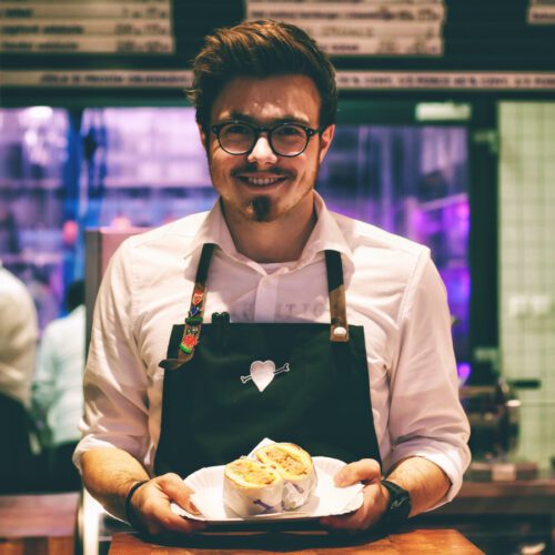 Restaurant server holding food