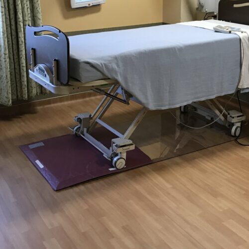 Hospital bed with SmartCells Flooring used as underlayment