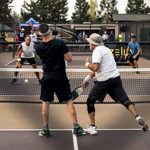 Pickleball players playing in a doubles match