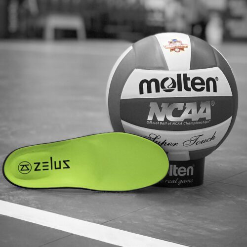 Zelus Insole sitting next to Volleyball