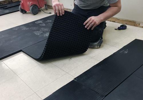 SmartCells Fall Protection Installation SmartCells tiles being installed as an underlayment in a medical facility