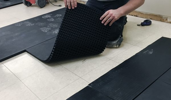 SmartCells Fall Protection Installation SmartCells tiles being installed as an underlayment in a medical facility