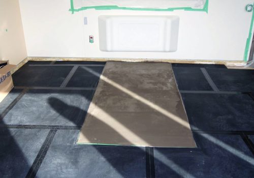 SmartCells Fall Protection flooring installation SmartCells tiles being installed as an underlayment in a medical facility