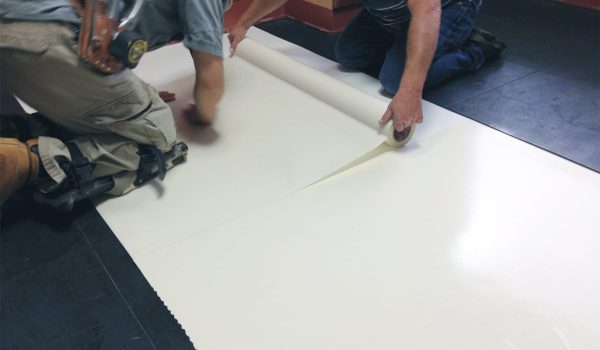 smartcells-fall protection-safe-room-installation SmartCells tiles being installed as an underlayment in a medical facility