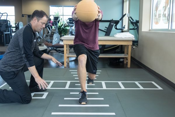 SmartCells Physical Therapy Mat Patient doing rehab exercises on the Smartcells Physical Therapy mat
